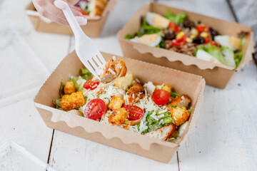Healthy salads in plastic package for take away or food delivery.