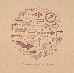 Hand-drawn doodle sketch arrows in various styles arranged in a circular pattern on old brown kraft paper