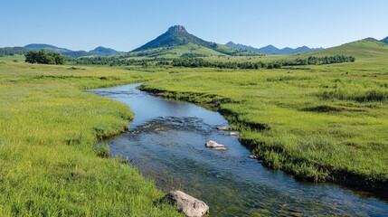 Mountain stream in a grassy valley.  Possible use Nature backdrop for travel brochures, or landscape calendars