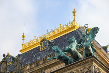 Roof decorations and Trigae statues on the National Theatre (Narodni divadlo) opera house building in Prague, Czech Republic