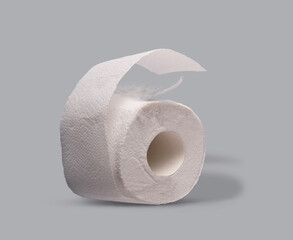 white feather cuddles on a roll of toilet paper on a blue background, copy space