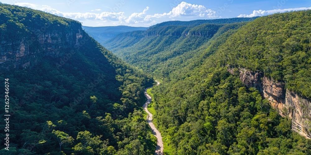Aufkleber An aerial view of a winding hiking trail through lush forests and steep cliffs, with a dynamic line of explorers creating a sense of adventure against a stunning backdrop