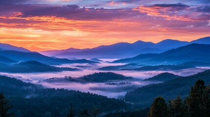 Obraz premium Serene Sunrise Over Mountain Range and Misty Valley Landscape