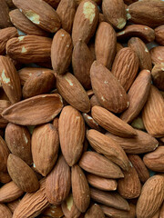 Close-up texture of raw almonds with natural surface details