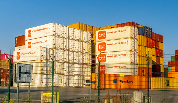 Large Stack of Shipping Containers of TEMU a giant new Chinese mail order company.