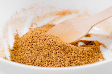 Mixed spices in a bowl: ginger, cinnamon, cardamom, pepper, cloves