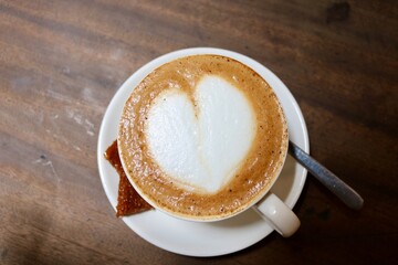 Cup of coffee on wooden table