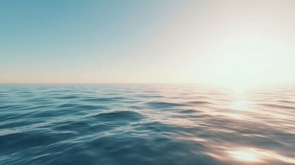 Obraz premium Serene Ocean Water with Gentle Waves and Soft Sunset Light