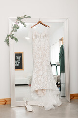 wedding dress hanging on a hanger
