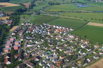 Aerial view on a village in fields, Switzerland, Zurich region