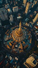 Aerial view of a stunning temple amidst urban cityscape at sunset.