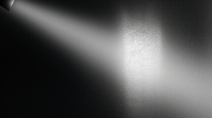 Obraz premium Abstract background featuring a spotlight illuminating a black wall with a gray gradient texture, creating a sleek and modern design with ample copy space for branding, advertising, or creative use, w