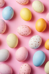 Easter eggs painted in different pastel colors to celebrate Easter. Dyed eggs on pink background, top down view.