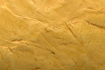 
plaster art background in yellow sand color