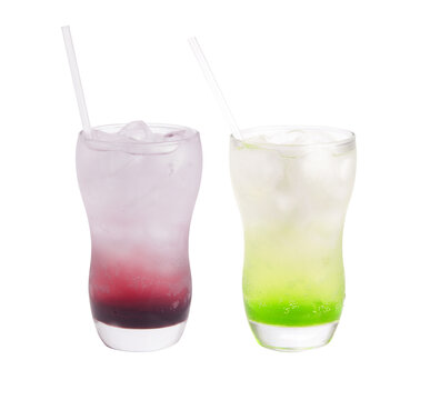 two glasses of italian soda with red futas and green apple in glass with ice and straw isolated on transparent background