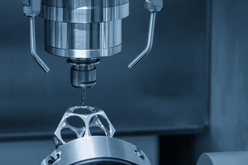 The 5-axis CNC milling machine  cutting the aerospace part with solid ball end mill tool. © Pixel_B