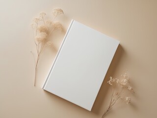 white book blank cover mockup on a beige background with dry flower flat lay mockup.