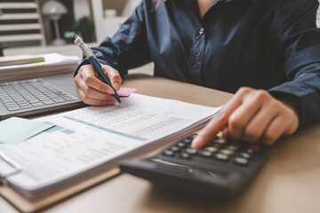 Accountant used a calculator financial analysis managing payroll tax accounting budget accounts.