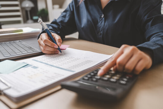Accountant used a calculator financial analysis managing payroll tax accounting budget accounts.