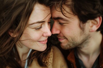 Portrait of a cheerful couple in their 30s looking into each other's eyes