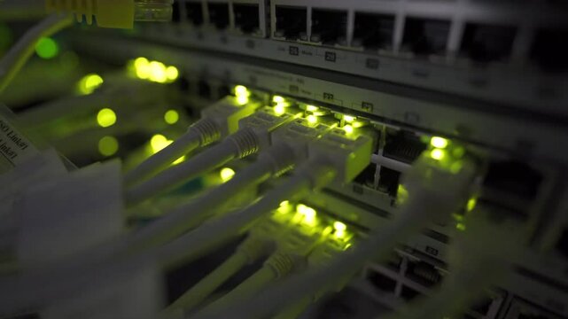 Close up view of internet ethernet cable on network switches background in server room data center