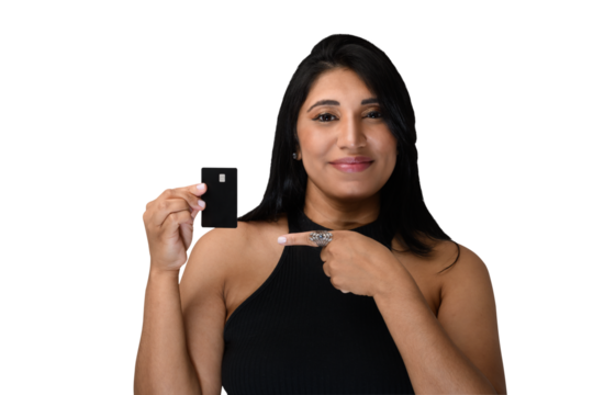 woman points to a black credit card in her hand.