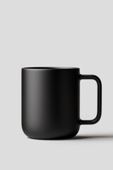 A sleek, modern black mug with a minimalist design, perfect for enjoying beverages in style.