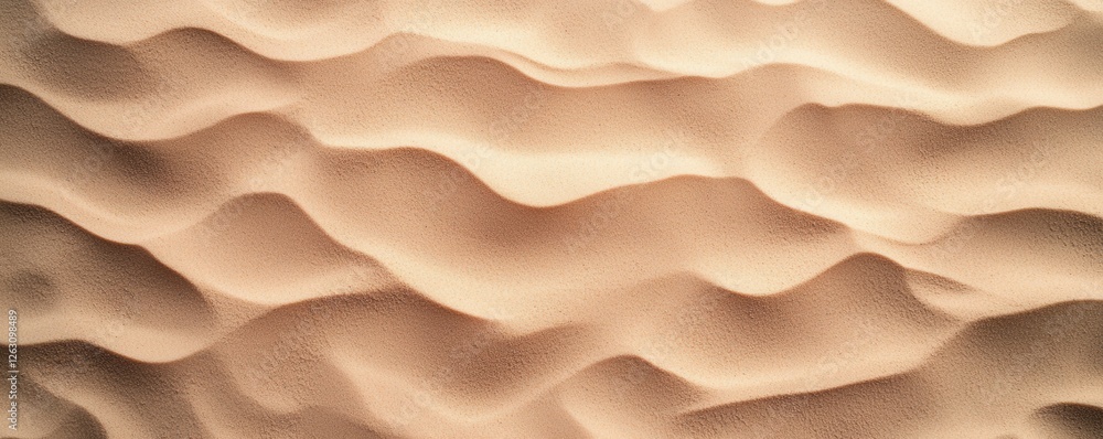 Poster the image features smooth, undulating patterns of sand, showcasing a natural texture created by wind