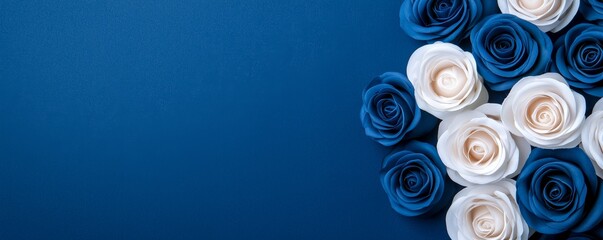 A serene arrangement of blue and white roses against a deep blue background, creating a calming and elegant visual.