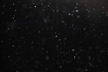 Abstract texture. Falling snow isolated on black background. Layer to overlay and blend snowfall into your photo project.	
