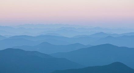 Layered Mountain Range at Dusk with Soft Blue Hues