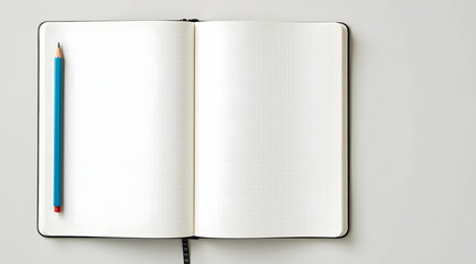 A blank notebook open on a clean surface with a blue pencil resting beside it inviting creativity and ideas