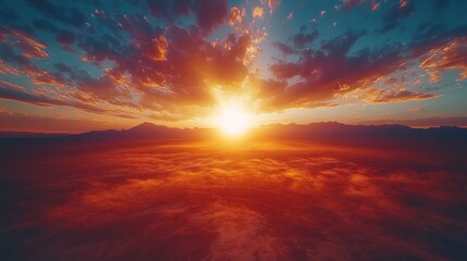 Fototapeta premium Fiery Sunset Over Mountain Range And Plains