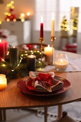 Festive table setting in room decorated for Christmas. Bokeh effect