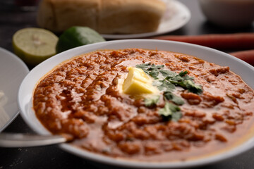 Pav bhaji is a fast food dish from India consisting of a thick vegetable curry served with a soft bread roll