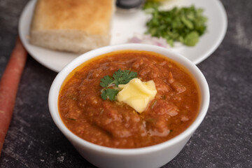 Pav bhaji is a fast food dish from India consisting of a thick vegetable curry served with a soft bread roll