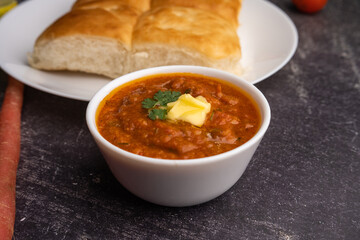 Pav bhaji is a fast food dish from India consisting of a thick vegetable curry served with a soft bread roll