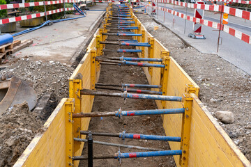 Trench on the road for renewal of urban infrastructure, like sewer system, cabling and fiber...