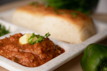 Pav bhaji is a fast food dish from India consisting of a thick vegetable curry served with a soft bread roll