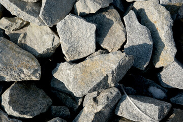 Rugged stones create an earthy mosaic under sunlight