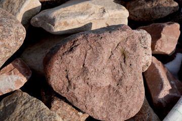 Natural textures of stones in a sunlit outdoor setting