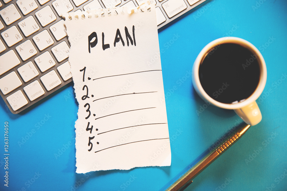 Poster notepad with text plan on the table.