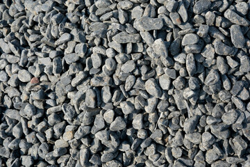 Natural gray gravel layered in an outdoor construction area