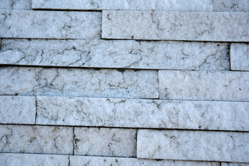 Natural stone texture showcasing layered design in sunlight