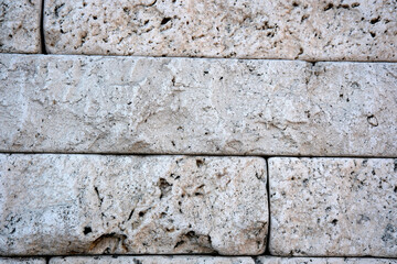 Textured stone wall showcasing natural patterns and colors