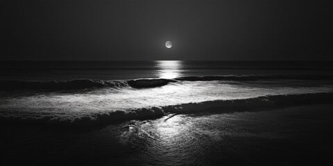 Monochrome ocean waves under a full moon reflecting on the water surface
