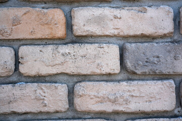 Textured brick wall showcasing rustic charm and artistic design