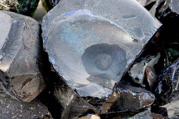 Shimmering pieces of obsidian glisten under the sunlight