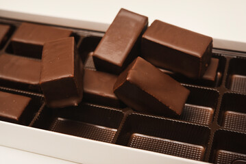 Chocolates in a box. A set of candies with white filling.