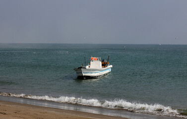 A lonely fishing boat by the sea